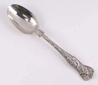 A Victorian cast silver dessert spoon with hunting scene, mask and shell back, maker Chawner and Co., London 1855, 68 grams 