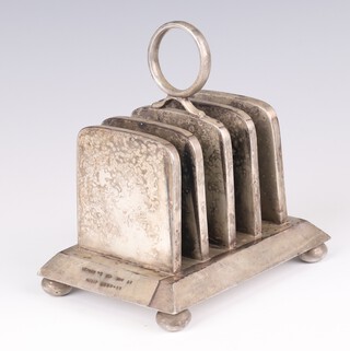 An Art Deco silver plated 5 bar heated toast rack by Lockwood, 75 New Bond Street, patent no.28511/08, the base numbered 5804 13cm 