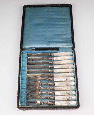 A set of 6 silver and other of pearl dessert forks, Sheffield 1895 together with 6 Continental silver bladed dessert knives with mother of pearl handles
