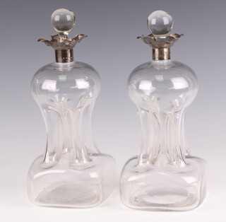 A pair of Edwardian silver mounted waisted decanters and stoppers, Birmingham 1909, 28cm