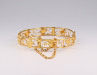 A 22ct yellow gold pierced bangle 9.7 grams internal diameter 5cm by 4.5cm