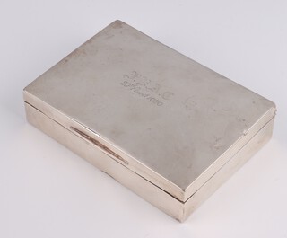 A rectangular silver cigarette box with presentation inscription 13cm, rubbed marks