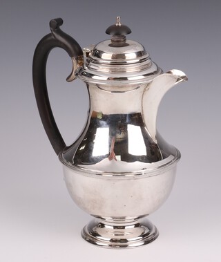 A silver coffee pot with ebony handle, Chester 1932, gross weight 410 grams