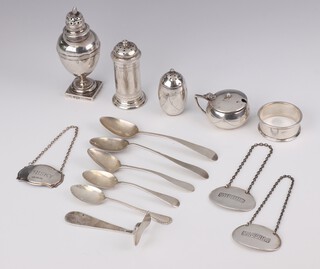 A Victorian silver Adam style pepperette London 1896 3cm, 2 other peppers, 3 spirit labels - Madeira, Sherry and Whisky, a mustard, napkin ring, pusher and 5 silver tea spoons, 298 grams 

