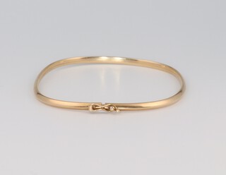 A 9ct yellow gold sprung bangle 3.3 grams gross 
