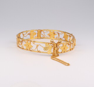 A 22ct yellow gold pierced bangle 9.5 grams internal diameter 5cm by 4.5cm