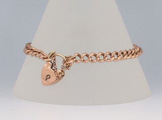 A 9ct yellow gold bracelet with heart padlock 18cm, 15.4 grams 