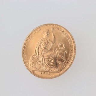 A gold 1965 Lima Peso 