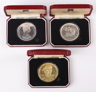 A silver commemorative Isle of Man 1976 crown 28 grams, 2 others, gross weight including sealed outer casing 90 grams 