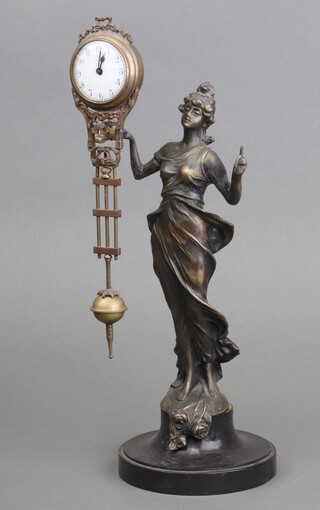 Jerome, a Mystery Clock with 4cm enabled dial, Arabic numerals, supported by a spelter figure of a standing lady 