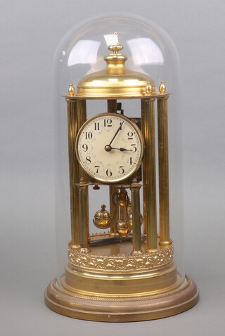 A Bandstand 400 day clock with 9cm paper dial, Arabic numerals, contained in a gilt metal case 42cm x 21cm, complete with glass dome 