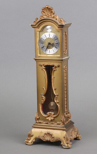 Schmid, a model of a longcase clock with 5cm arched gilt dial, silver chapter ring and Roman numerals, contained in a yellow plastic case 33cm x 11cm x 10cm 