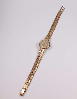 A lady's 9ct yellow gold Omega wristwatch on a ditto bracelet, contained in an 18mm case, gross weight including movement and glass 23.2 grams