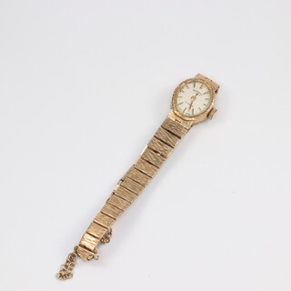 A lady's 9ct yellow gold Rotary wristwatch on a ditto bracelet, 12.3 grams including grass 