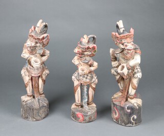 Three Balinese polychrome painted carved Kris stands in the form of Hanuman