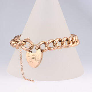 A 9ct yellow gold bracelet with heart padlock 21.7 grams, 18cm 