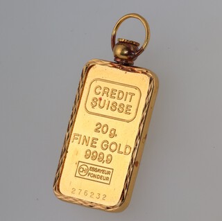 A Singapore Mint 20 gram 999.9 standard ingot in a 3.5 gram 22ct gold mount 
