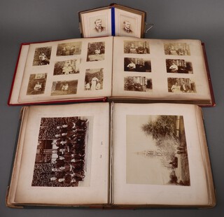A photograph album containing a collection of early black and white photographs of the staff and buildings of Wolverhampton Grammar School, Emanuel School together with a red card photograph album containing 80 black and white photographs, family groups, Kings College Cambridge and a brown leather album containing 20 black and white portrait photographs of ladies and gentleman, mostly from the Wolverhampton area 