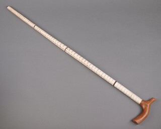 A walking stick formed from a sharks vertebrae 85cm 