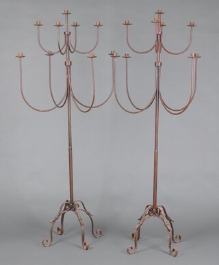 A large and impressive pair of 20th Century 9 light wrought iron floor standing candelabrum 180cm h x 86cm w 