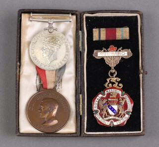 A Second World War British War medal, un-named, as issued, a Masonic silver gilt and enamelled Royal Institute of The Girls charity jewel 1934, an Edward VIII May 24th 1928 commemorative medal and an Africa Star ribbon bar 
