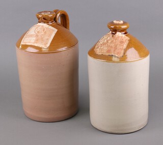 Two stoneware ink flagons, both marked Brilliant Red Ink and The Educational Supply Association Ltd, 36cm and 34cm, 1 with handle, 1 without, cork sealed 