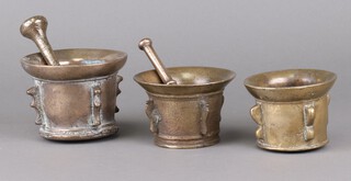 Three 18th Century, 4 handled, bell metal mortars 10 x 13cm, 8 x 12cm, 8 x 10cm, and 2 pestles 