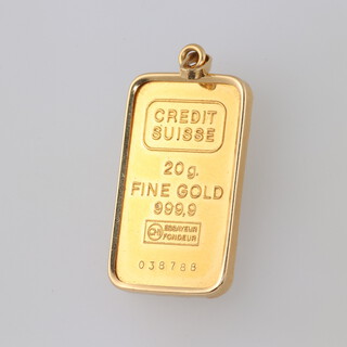 A Singapore Mint 20 gram 999.9 standard ingot in a 1.6 gram 18ct gold mount 