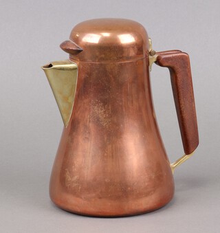 Karl Hagenauer, a mid-Century waisted copper jug with wooden handle, the base marked Karl Werkstatten Hagenauer Wien, Made in Austria 18cm x 12cm 