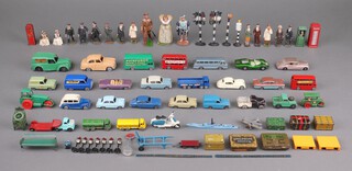 A collection of Lesney, Dinky model cars, road signs, traffic lights and Britains figures inc Henry VIII and Elizabeth I.