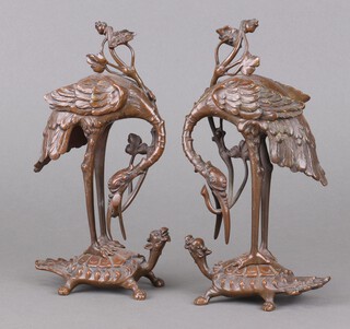 A pair of Meiji Period bronze figures of storks standing on turtles 23cm x 10cm x 5cm 