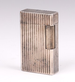A gentleman's silver plated cased cigarette lighter with ribbed decoration 