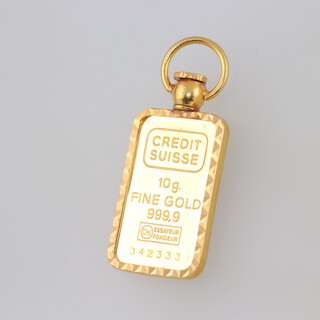A Singapore Mint 10 gram 999.9 standard ingot in a 4.2 gram 22ct gold mount 