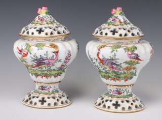 A pair of Samson porcelain urns and covers of melon form, the bases with anchor mark 27cm 