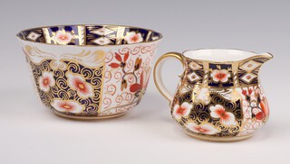 A Victorian Royal Crown Derby Imari pattern sugar bowl, the base marked James Green and Nephew 252451 14cm, a similar jug (cracked) 