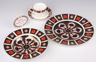 A Royal Crown Derby Imari pattern table sign L11 7cm, a Royal Crown Derby Imari pattern plate 1128 27cm, a ditto soup bowl, 22cm, cup and saucer XLIX (the last 3 items are seconds)