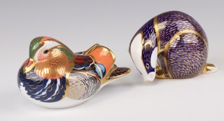 Two Royal Crown Derby Imari pattern paperweights - badger LVI with gold stopper 9cm, Mandarin duck MMI gold stopper 8cm 