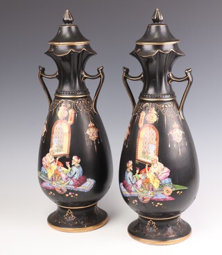 A pair of Edwardian black ground twin handled pottery urns and covers decorated tea drinking scene, the base marked Arabian, Made in England, impressed Naples 45cm 