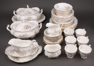 A Royal Albert Hayworth pattern tea and dinner service comprising 2 tureens and covers, oval meat plate, sauce boat and stand, 6 dinner plates, 6 side plates (1 cracked), 6 soup bowls, 6 dessert bowls, bread plated (2nd), 6 tea plates, milk jug, sugar bowl, 6 cups and 6 saucers 