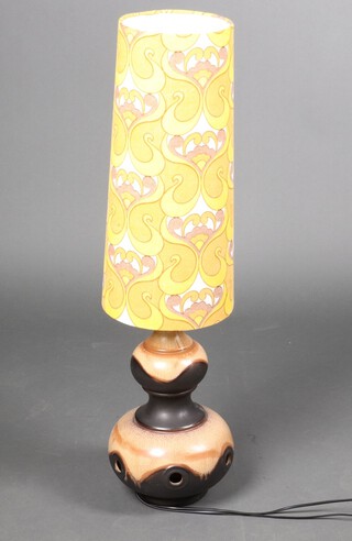 A West German mid-Century brown glazed and pierced pottery table lamp, marked West Germany-385-40 41cm h with original shade