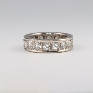 A white gold, testing as 18ct, 16 diamond set eternity ring, approx. 2.4ct, size I 1/2, 6 grams