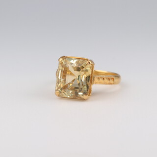 A 22ct yellow gold rectangular cut citrine ring, size J, 4.7 grams
