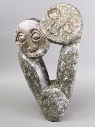 A Makore, a Zimbabwe Shona carved hardstone figure group, signed 59cm h x 35cm w 