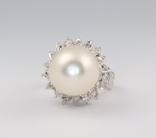 An 18ct white gold vintage cultured pearl and diamond ring, the diamonds approx. 0.4ct, the cultured pearl 12mm, 9.4 grams, maker Manning, size J 