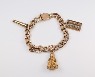 A 14ct yellow gold flat link bracelet with 3 gold charms, bracelet stamped Manning, 18cm, 30.7 grams 