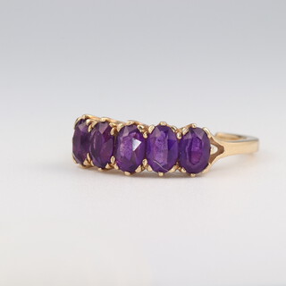 A 9ct yellow gold 5 stone amethyst ring size R, 3.3 grams 