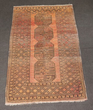 A tan and black ground Afghan rug with 4 octagons to the centre within a multi row border 205cm  x 128cm 