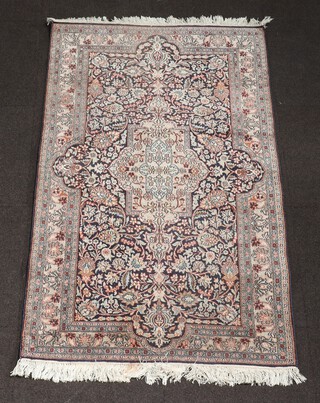 A blue and green ground, floral patterned North Persian rug with central medallion 160cm x 95cm 