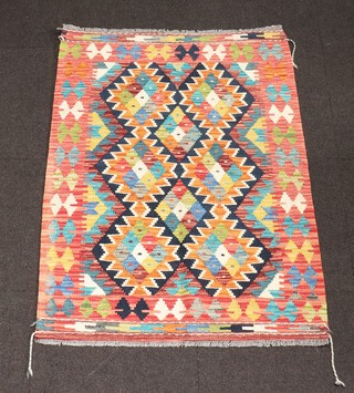 A black, green and white ground Chobi Kilim with overall geometric designs 123cm x 84cm 