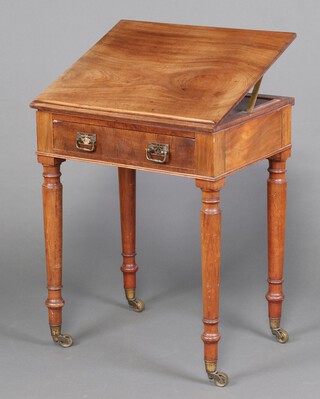 A 19th Century rectangular mahogany reading table with rising top, fitted a drawer, raised on turned supports, brass caps an casters 75cm h x 61cm w x 51cm d 